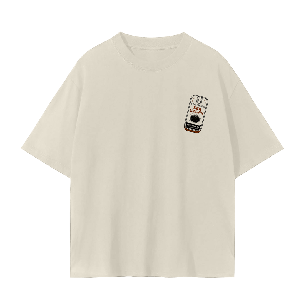 An cream short-sleeve crewneck t-shirt with a small graphic print on the left chest depicting a canned seafood.