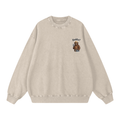 A light beige crewneck sweatshirt with a small graphic on the left chest showing an outdoor bear wearing a hat and the text 'Daddy?'.