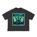 A dark gray short-sleeve boxy wide t-shirt with stylized picture of a person crouching in front of abstract mural of tiger head.