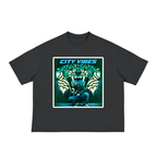 A dark gray short-sleeve boxy wide t-shirt with stylized picture of a person crouching in front of abstract mural of tiger head.
