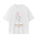 A white short-sleeve t-shirt with a football player catching a ball, with the text 'FOG & FORM' and 'THE CATCH' printed below in brown and red.