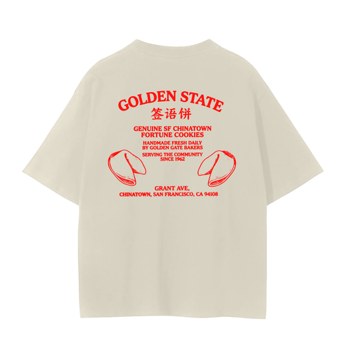 An oversized cream-colored t-shirt shown from the back, featuring SF Chinatown Fortune Cookies.
