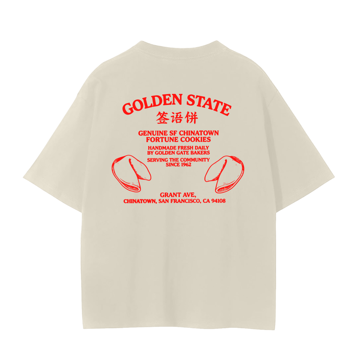 An oversized cream-colored t-shirt shown from the back, featuring SF Chinatown Fortune Cookies.