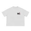 A white boxy t-shirt with a small chest graphic featuring a lowrider car and the Golden Gate Bridge.
