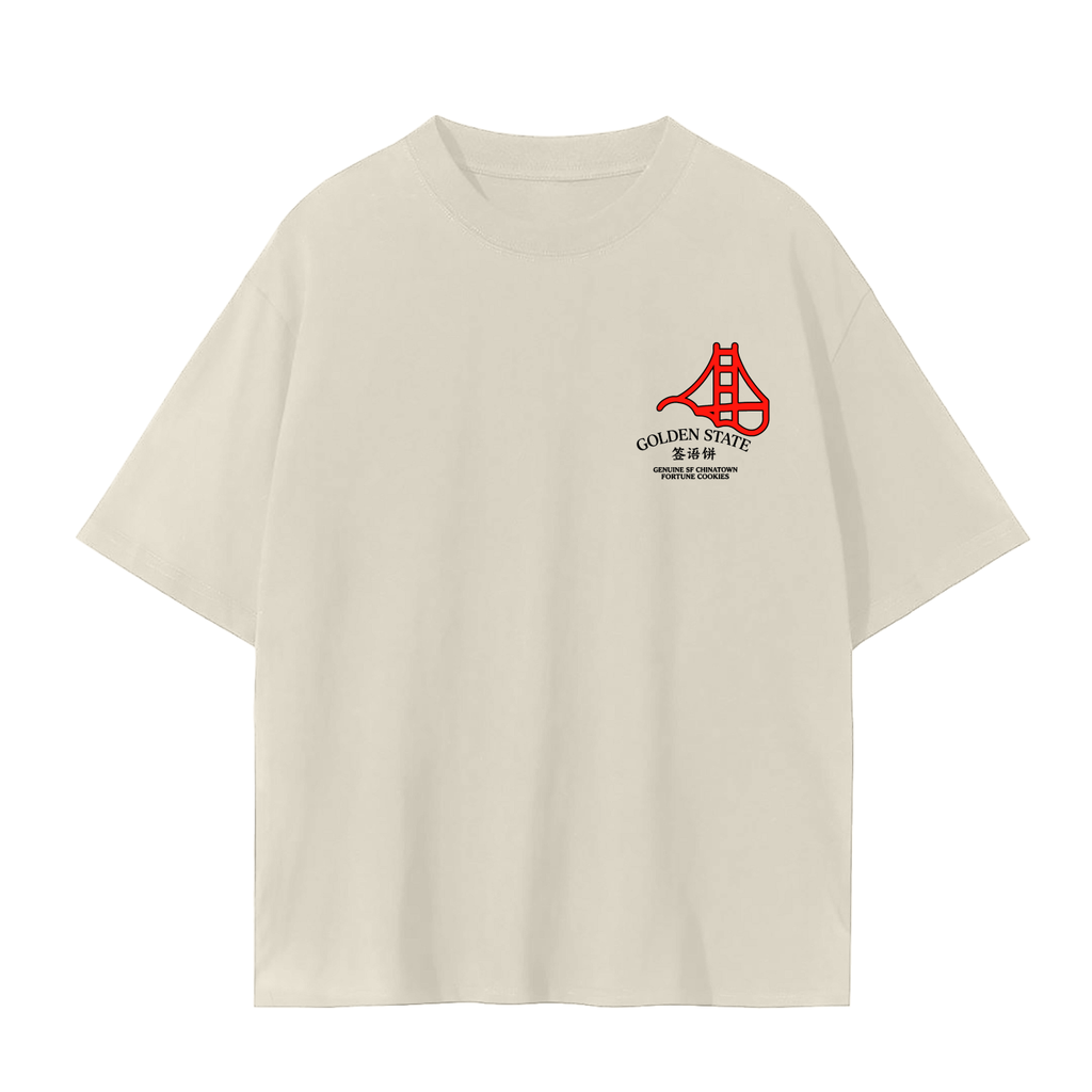 A cream-colored short-sleeve t-shirt with a red and black Golden Gate Bridge graphic on the left chest.