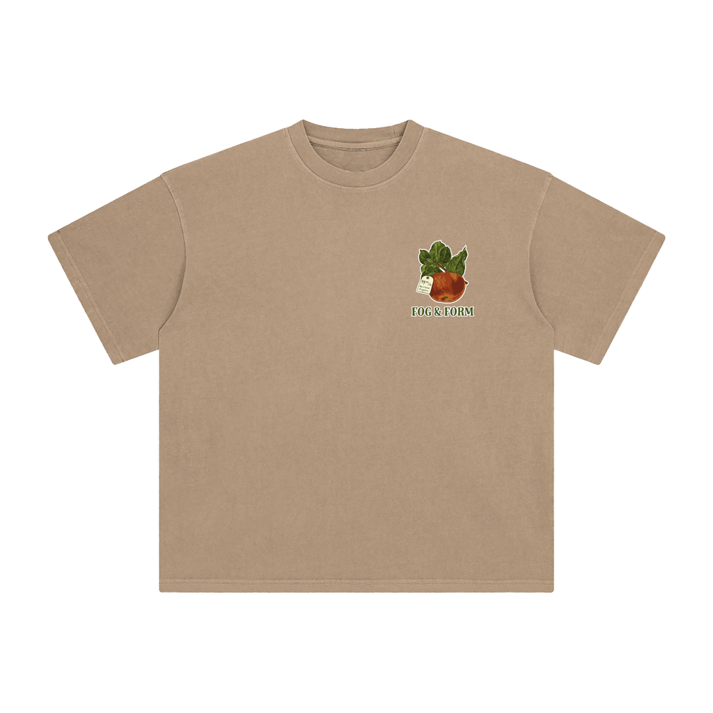 A light brown short-sleeve crewneck t-shirt with a small graphic on the left chest showing an apple.