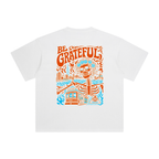 Back of Fog & Form Be Grateful graphic washed white T-shirt featuring a colorful San Francisco illustration celebrating Bay Area culture, music, and everyday streetwear.